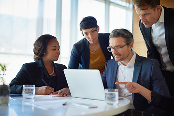 Image showing Planning, stock brokers working with laptop and in a boardroom of their workplace. Collaboration or teamwork, brainstorming or finance and coworkers at desk in a modern office discussing a project