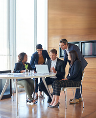 Image showing Meeting, collaboration and business people in discussion with a laptop for corporate planning. Teamwork, technology and group of professional employees working on a project together in the workplace.