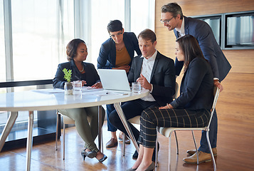 Image showing Meeting, teamwork and business people in discussion in the office with a laptop for accounting planning. Collaboration, technology and group of accountants working on a finance project in workplace.