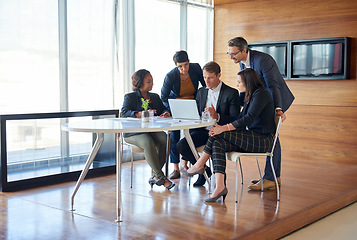 Image showing Discussion, collaboration and team in a meeting with laptop for corporate planning in the office. Teamwork, technology and group of professional employees working on project together in the workplace