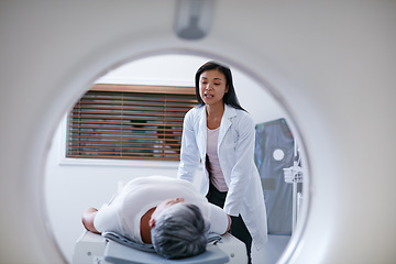 Image showing Doctor, mri and woman with patient in hospital ready to start scanner machine. Ct scan, examination and medical professional with senior person before cancer radiology test for healthcare in clinic.