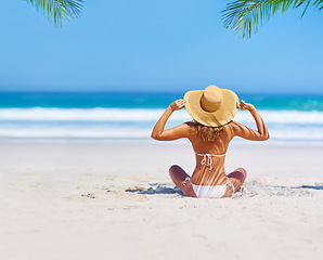 Image showing Travel, beach and woman on island for holiday, tropical adventure and vacation in Mauritius. Tropical mockup, ocean and back of female person relax in bikini by sea for tourism, summer and getaway