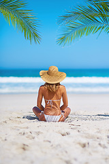 Image showing Tropical, holiday and back of woman on beach sand for adventure, summer and vacation in Mauritius. Travel mockup, ocean and female person relax in bikini by ocean for tourism, traveling and getaway