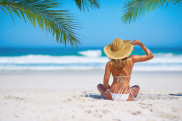 Image showing Tropical island, beach and back of woman for summer adventure, holiday and vacation in Mauritius. Travel mockup, ocean and female person relax in bikini on sand for tourism, traveling and getaway