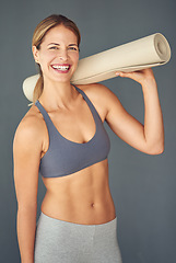 Image showing Happy woman, fitness and portrait smile with yoga mat for workout exercise or healthy body against a grey studio background. Female person or yogi smiling for spiritual wellness, zen or mental health