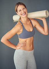 Image showing Happy woman, portrait and yoga mat for zen workout, exercise or healthy body against a grey studio background. Female person or yogi with smile for spiritual wellness, fitness and mental health