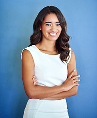 Image showing Happy, arms crossed and portrait of business woman in studio for professional, entrepreneur and mission. Pride, smile and empowerment with female employee on wall background for creative and career