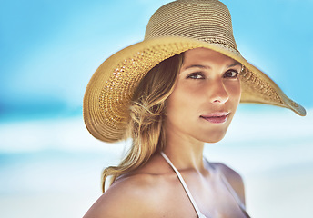 Image showing Holiday, summer and portrait of woman at beach for vacation, tropical and relax mockup. Wellness, nature and travel with face of female tourist and hat at seaside for sunbathing and paradise