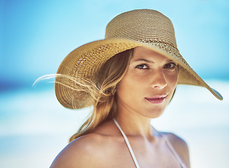 Image showing Travel, vacation and portrait of woman at beach for summer, tropical and relax mockup. Wellness, nature and holiday with face of female tourist and hat at seaside for sunbathing and paradise