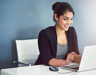 Image showing Technology, businesswoman with laptop and at her desk of a modern workplace office. Social networking or online communication, connectivity and female person typing an email at her workstation