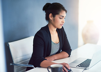 Image showing Social networking, businesswoman with laptop and at her desk in a modern workplace office with a lens flare. Online communication or technology, connectivity and female person at her workspace