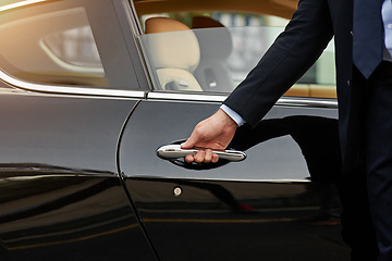 Image showing Businessman, hands and chauffeur by car door for travel accommodation, designated driver or commute. Hand of male person on vehicle handle in professional transport service, business class or pick up