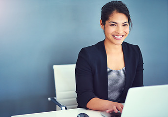 Image showing Confidence, portrait and businesswoman working in the office on laptop by wall with mockup space. Happy, smile and professional female human resources manager doing research in workplace with mock up