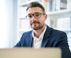 Image showing Portrait, corporate and a businessman with a laptop in an office for an email or online communication. Smile, career and a mature employee with a computer for remote work and connection in a house