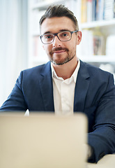 Image showing Portrait, working and a businessman with a laptop in an office for an email or online communication. Smile, career and a mature employee with a computer for remote work and connection in a house