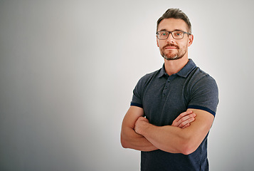 Image showing Mockup, portrait and mature man with arms crossed, calm and casual outfit against a grey studio background. Face, male person and model with glasses, Canada and peace with confidence and happiness