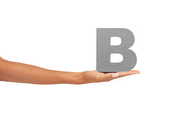 Image showing Alphabet, capital letter B and hand in studio for learning font, education and isolated on white background. Closeup woman with grammar character, icon for teaching language and mockup space in palm