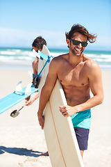 Image showing Travel, summer and surfing friends on the beach together together for vacation or holiday trip overseas. Surf, ocean or fun with a young man surfer in sunglasses and friend bonding outdoor by the sea