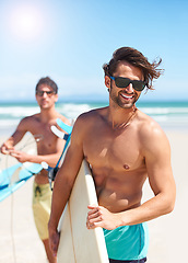 Image showing Beach, travel and man surfing friends outdoor together for summer vacation or holiday trip overseas. Surf, sea or fun with a shirtless young male surfer in sunglasses and friend bonding on the coast