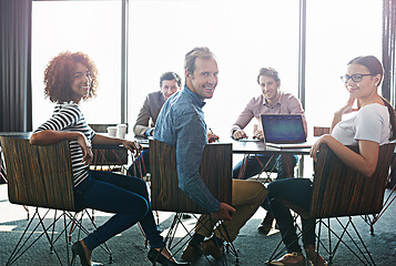 Image showing Meeting, portrait and teamwork in workplace for creative planning with smile in a startup. Business, group and collaboration at table with happiness with laptop for a project with brainstorming.