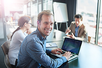 Image showing Happy, meeting and portrait of a businessman with a laptop for notes, email or planning at work. Smile, teamwork and a corporate worker with a computer for project management collaboration in office