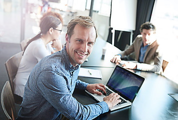 Image showing Smile, meeting and portrait of a businessman with a laptop for notes, email or planning at work. Expert, teamwork and a corporate worker typing on a pc for project management collaboration in office