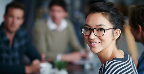 Image showing Woman leader, portrait and startup team in blurred background, meeting and smile with confidence. Young businesswoman, leadership and happy with group, workplace or creativity in collaboration at job