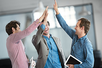 Image showing Success, winners or excited business people high five after a winning a deal or group partnership achievement. Teamwork, startup or happy employees in celebration together with support or solidarity