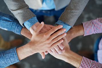 Image showing Teamwork, top view and hands together for cooperation, team building or solidarity. Collaboration, hand huddle and group of people with motivation, trust or support for community goals in partnership