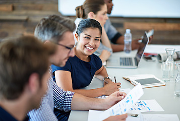 Image showing Portrait, happy and a business woman in the boardroom with her team during a meeting for planning. Smile, strategy or collaboration with a female employee and colleagues in the office for a workshop