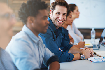 Image showing Portrait, happy and a business man in the boardroom with his team during a meeting for planning. Smile, strategy or collaboration with a male employee and colleagues in the office for a seminar