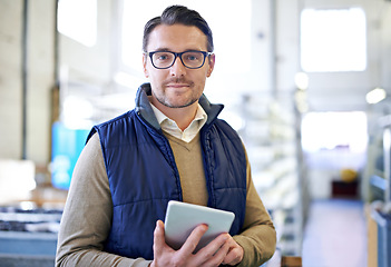 Image showing Tablet, serious and portrait of man in factory for manufacturing, networking and inventory. Distribution, industrial and technology with male employee in warehouse for inspection, export and storage