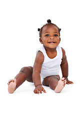 Image showing Smile, sitting and African girl baby isolated on white background with playful happiness and growth. Learning, playing and laughing, happy black kid on studio backdrop for development and child care.