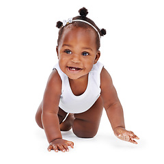 Image showing Smile, crawl and African girl baby isolated on white background with playful happiness and growth. Learning, playing and development, happy face of black child crawling on floor on studio backdrop.