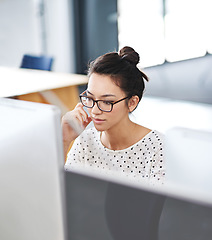 Image showing Focus, computer and business woman in office for research, website and designer. Thinking, entrepreneur and creative with female employee in digital agency for technology, professional and startup