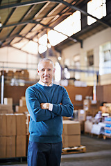 Image showing Arms crossed, smile and portrait of man in warehouse for cargo, storage and shipping. Distribution, ecommerce and logistics with employee in factory plant for supply chain, package and wholesale