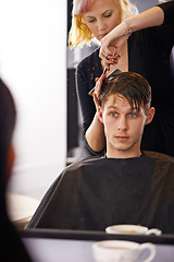 Image showing Hair studio, hairstylist and mirror reflection of man for hairstyle, grooming and cleaning in beauty spa salon. Hairdresser, service woman and studio people, customer or person for texture haircut
