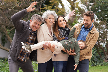 Image showing Happy family, child and portrait of people playing with kid in a park on outdoor vacation, holiday and excited together. Grandparents, happiness and parents play as love, care and bonding in nature