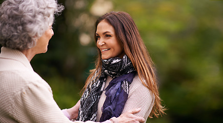 Image showing Care, nature and woman with elderly mother together on a outdoor vacation or holiday bonding in happiness on mockup space. Retirement, women and happy person in conversation and laughing with mom