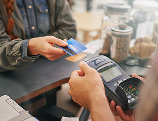 Image showing Credit card, debit machine and customer in cafe with hands of cashier for shopping, point of sale and checkout. Payment technology, bills and closeup of person paying for finance in restaurant store