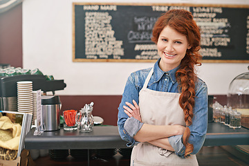 Image showing Portrait, woman and barista with arms crossed, coffee shop and startup success with skills. Face, female entrepreneur and employee with leadership, business development and profit growth in a cafe