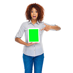 Image showing Woman, point and green screen tablet in studio for social media app, review and mockup by white background. Isolated african lady, model and touchscreen for web design job, space and surprise face