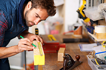 Image showing Man, focus wood and tape measure for construction, home development and building renovation. Carpenter, maintenance employee and male repairman worker on a contractor job of builder working in house