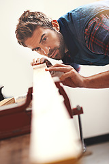 Image showing Carpenter, wood and planning with man in workshop for building, manufacturing and creative. Design, industry and woodworker with handyman measuring on workbench for builder, lumber and maintenance