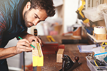 Image showing Carpenter, wood and drawing with man in workshop for building, manufacturing and creative. Planning, industry and woodworker with handyman measuring on workbench for builder, lumber and maintenance