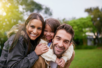 Image showing Family, piggy back and park portrait with a mom, dad and girl together with happiness and smile. Outdoor, face and summer vacation of a mother, father and kid with bonding, parent love and child care