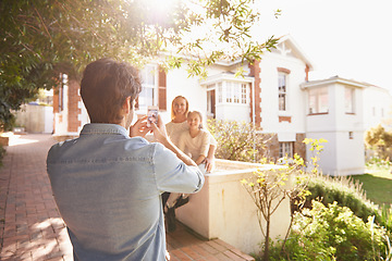 Image showing Father take picture of mother and girl by home for memories, social media post and bonding. New house, photograph and dad taking photo of mom and child for happiness, relaxing and smile on property