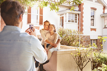 Image showing Happy family house, phone and garden photo of kid, mother or people with papa capture outdoor picture. Love hug, cellphone and bonding mom, dad and child relax, smile and enjoy quality time together