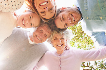 Image showing Faces portrait, circle and happy family hug, grandparents and parents bonding with kid child in nature park. Care, solidarity or below view of people smile for natural sunshine, love support or peace