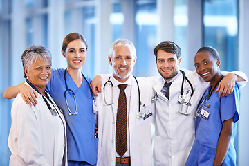 Image showing Healthcare, team and portrait of doctors and nurses standing in a corridor of the hospital. Confidence, diversity and happy professional medical workers with smile in collaboration in medicare clinic